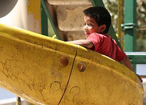 Boy on jungle gym at Mazatlan city park